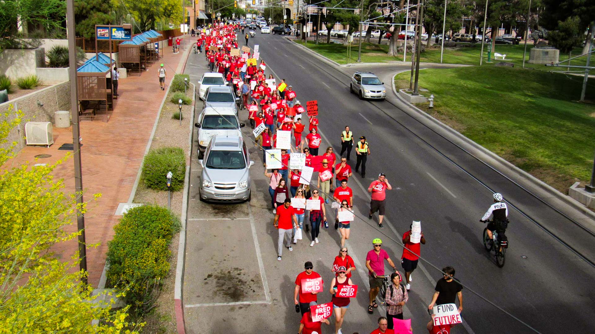 Hundreds of teachers and families march down Congress street chanting for better teacher pay and funding for education, 2018.