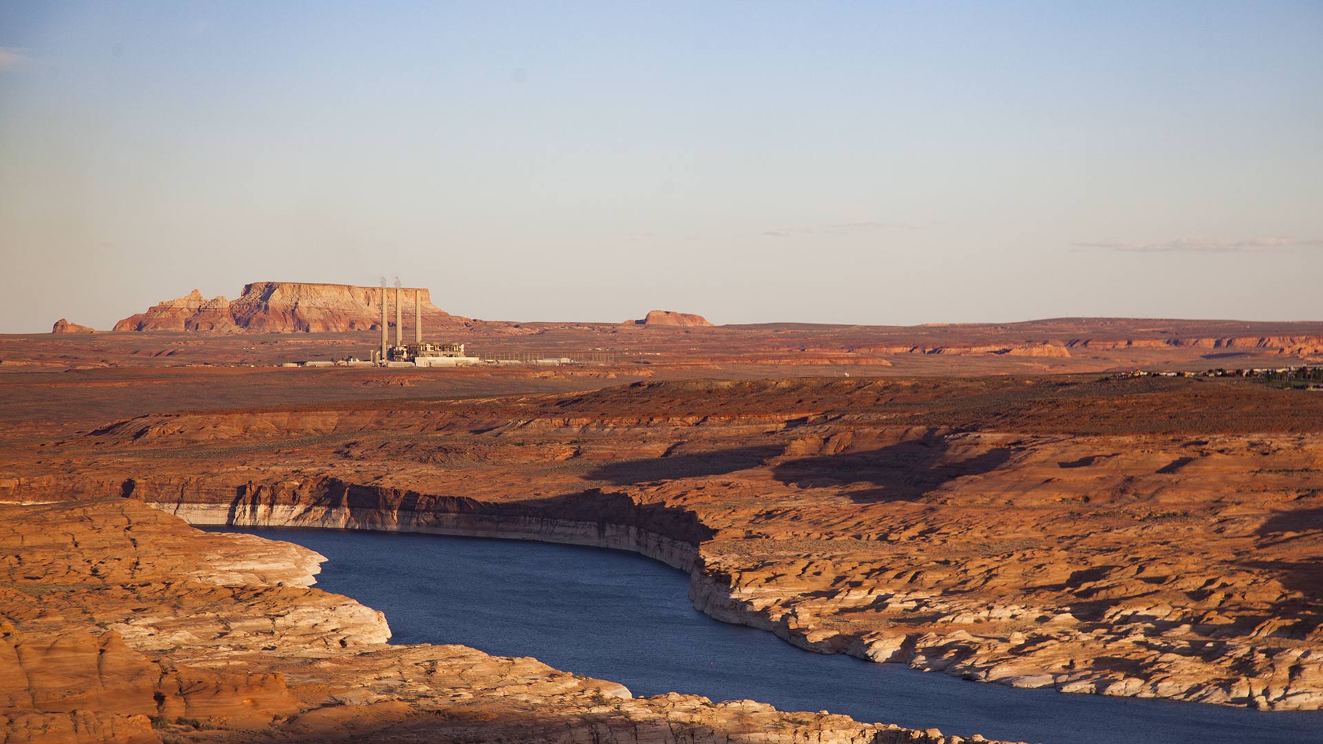 The Navajo Generating Station can be seen beyond Lake Powell near Page, Arizona, April 2018.