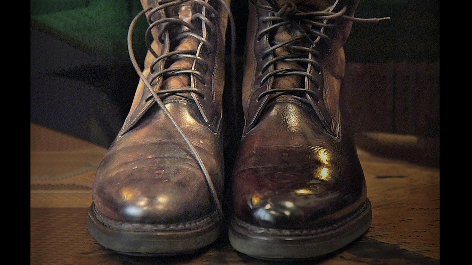 A pair of boots before and after a shine - 