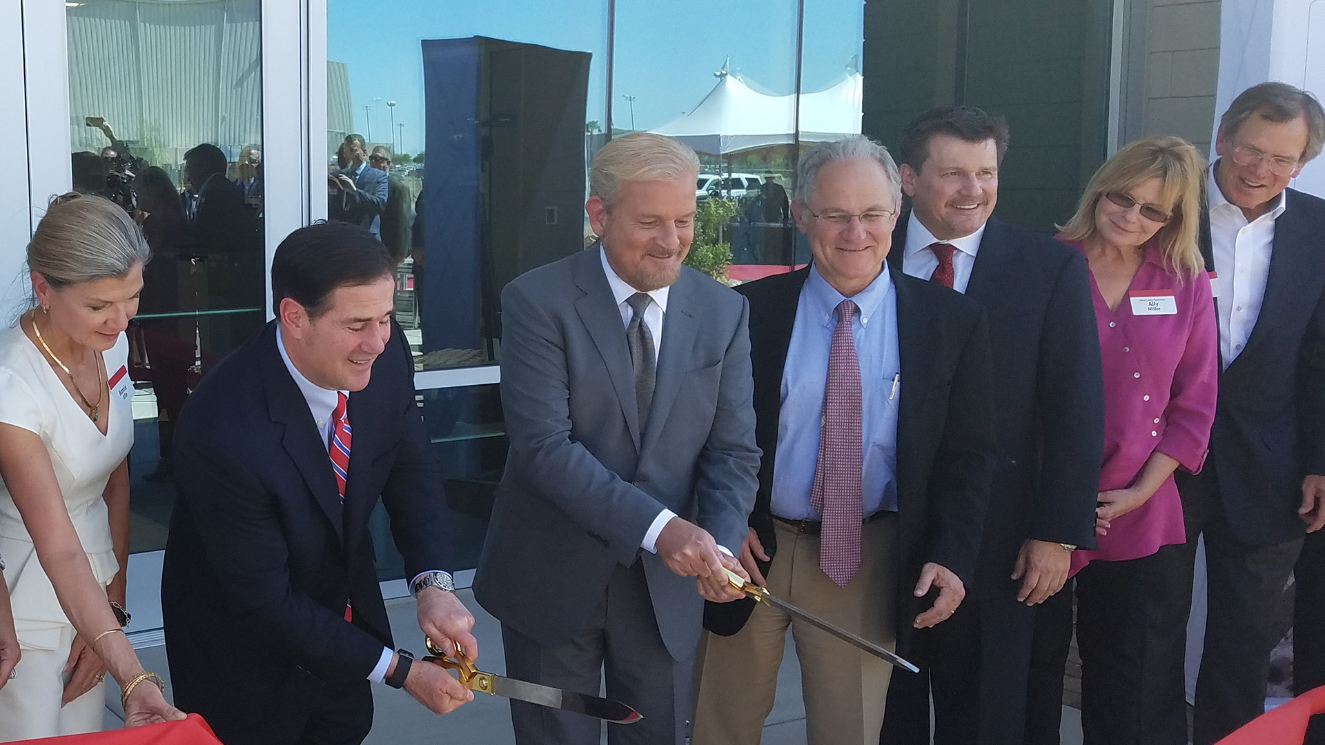 Mayor Rothschild, center, attends a ribbon-cutting for a new expansion at Raytheon last week. The expansion was made possible by realigning a road and allowed the city to install water lines prior to the arrival of a tenant.