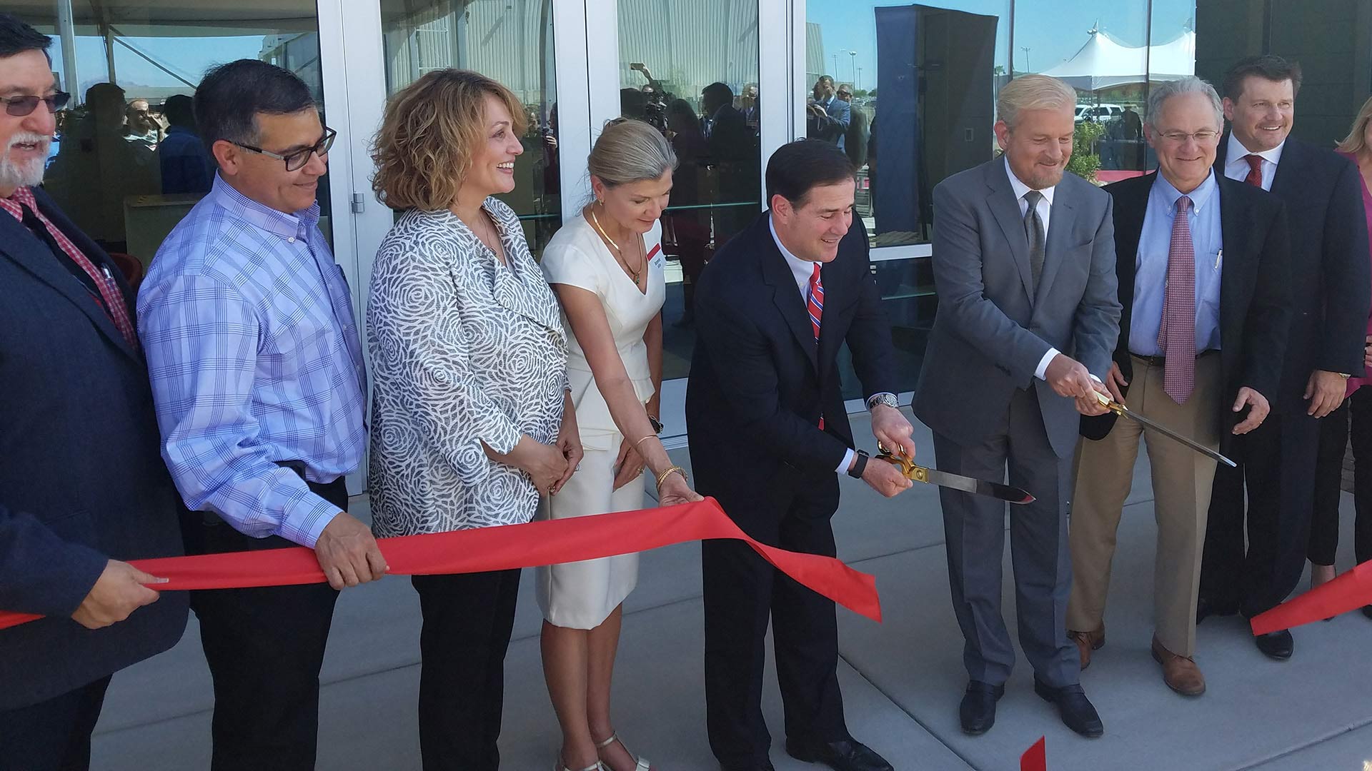 Local officials and Raytheon executives gather to cut the ribbon on the newest addition to Raytheon Missile System's Tucson facility.