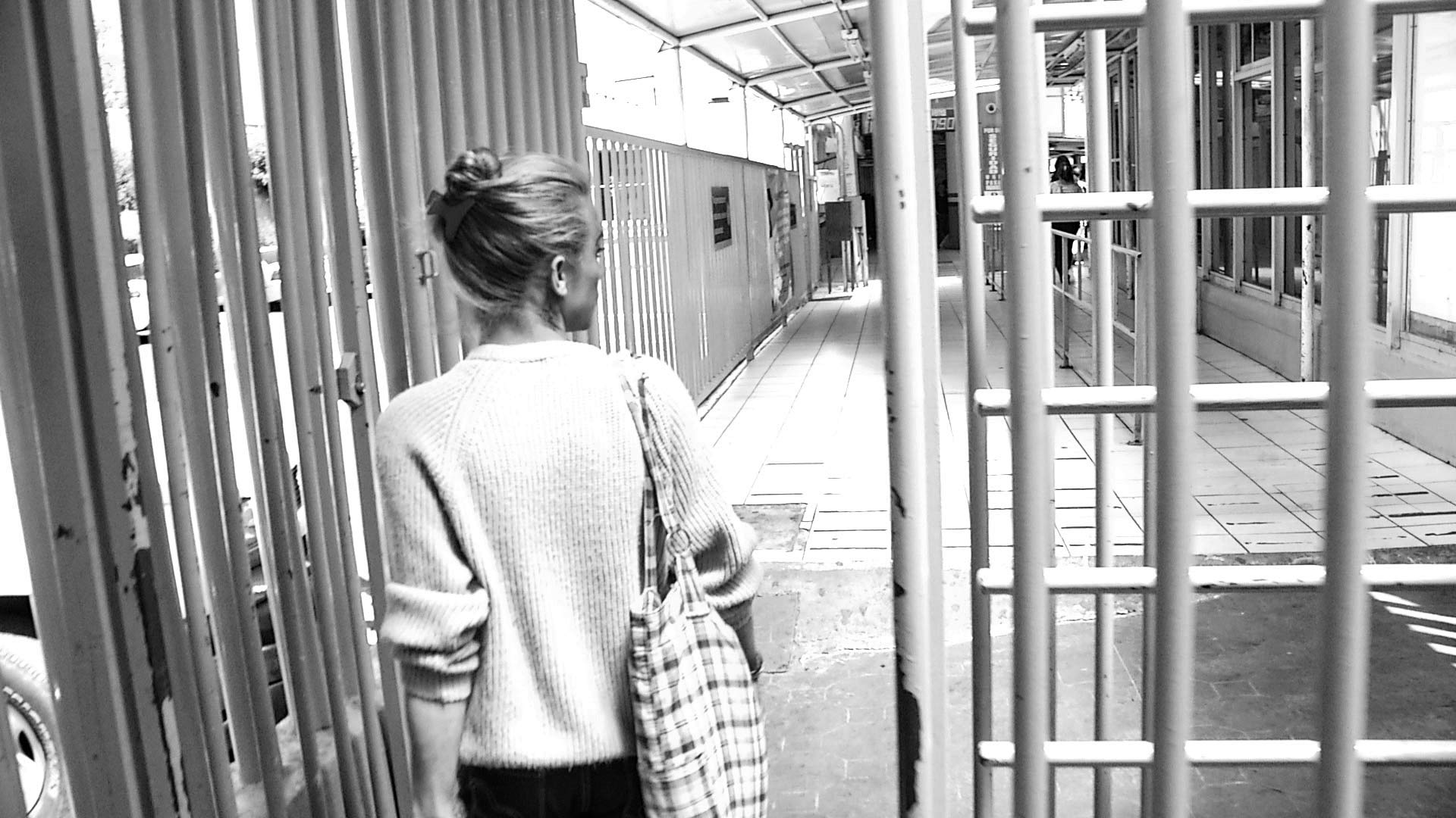 Nicol, a transgender woman from Honduras, walks toward the U.S. from Mexico through the port of entry in Nogales, Sonora.