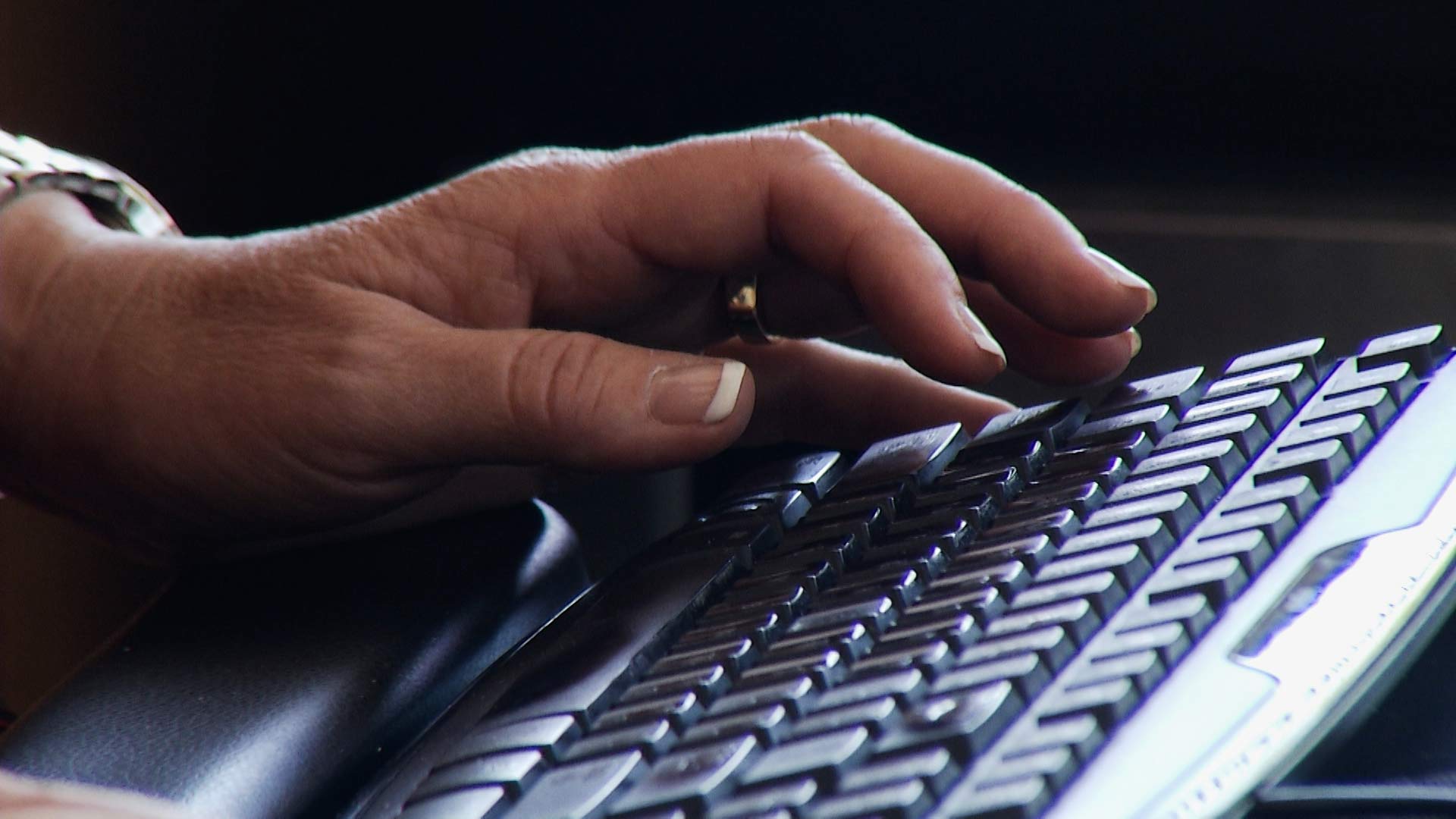 Typing on a computer keyboard.