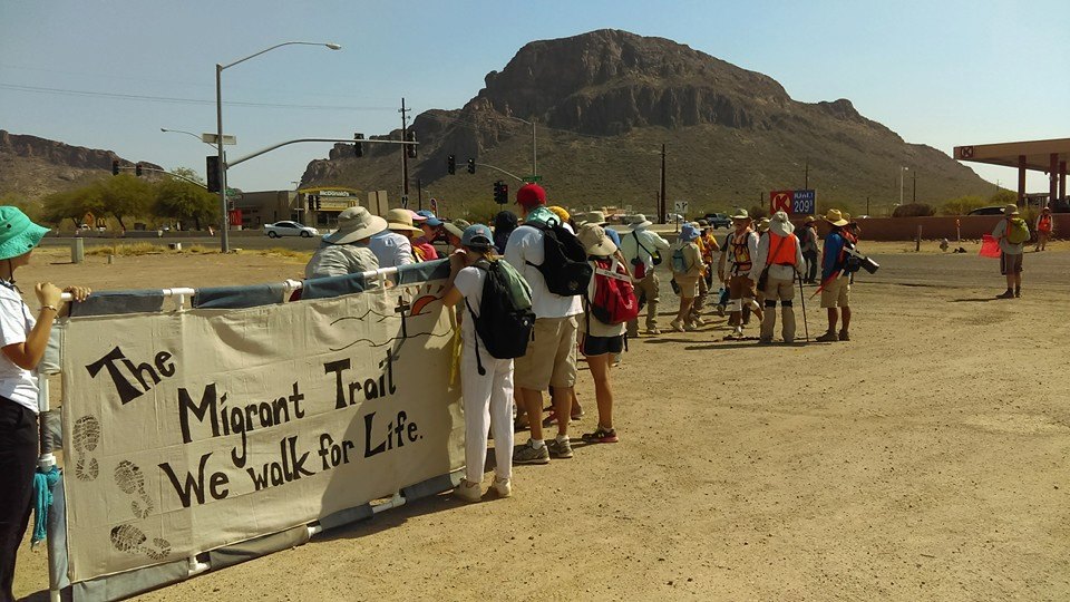 Walkers reaching the end of their 75-mile journey in 2016.