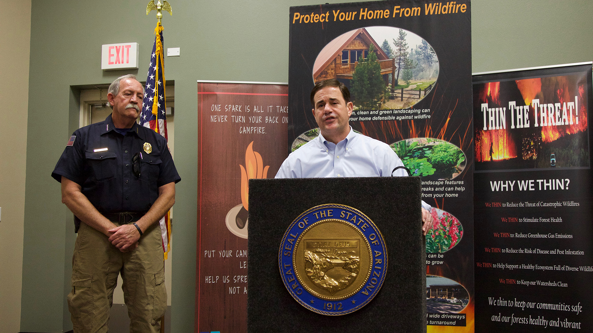 Gov. Doug Ducey, right, and State Forester Jeff Whitney speaking to a crowd of land managers and first responders in Tucson Thursday, May 31, 2018.