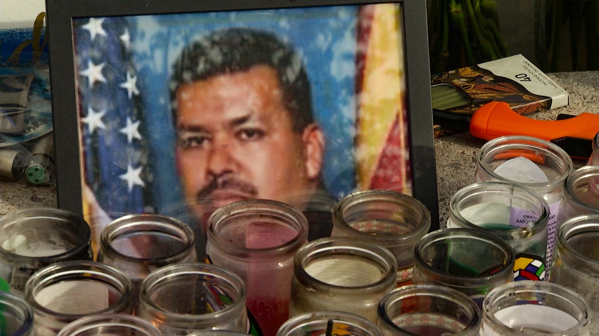 Candles burning to remember Jesus Cordova, a Nogales, Arizona, police officer killed responding to an emergency call April 27, 2018, file photo.