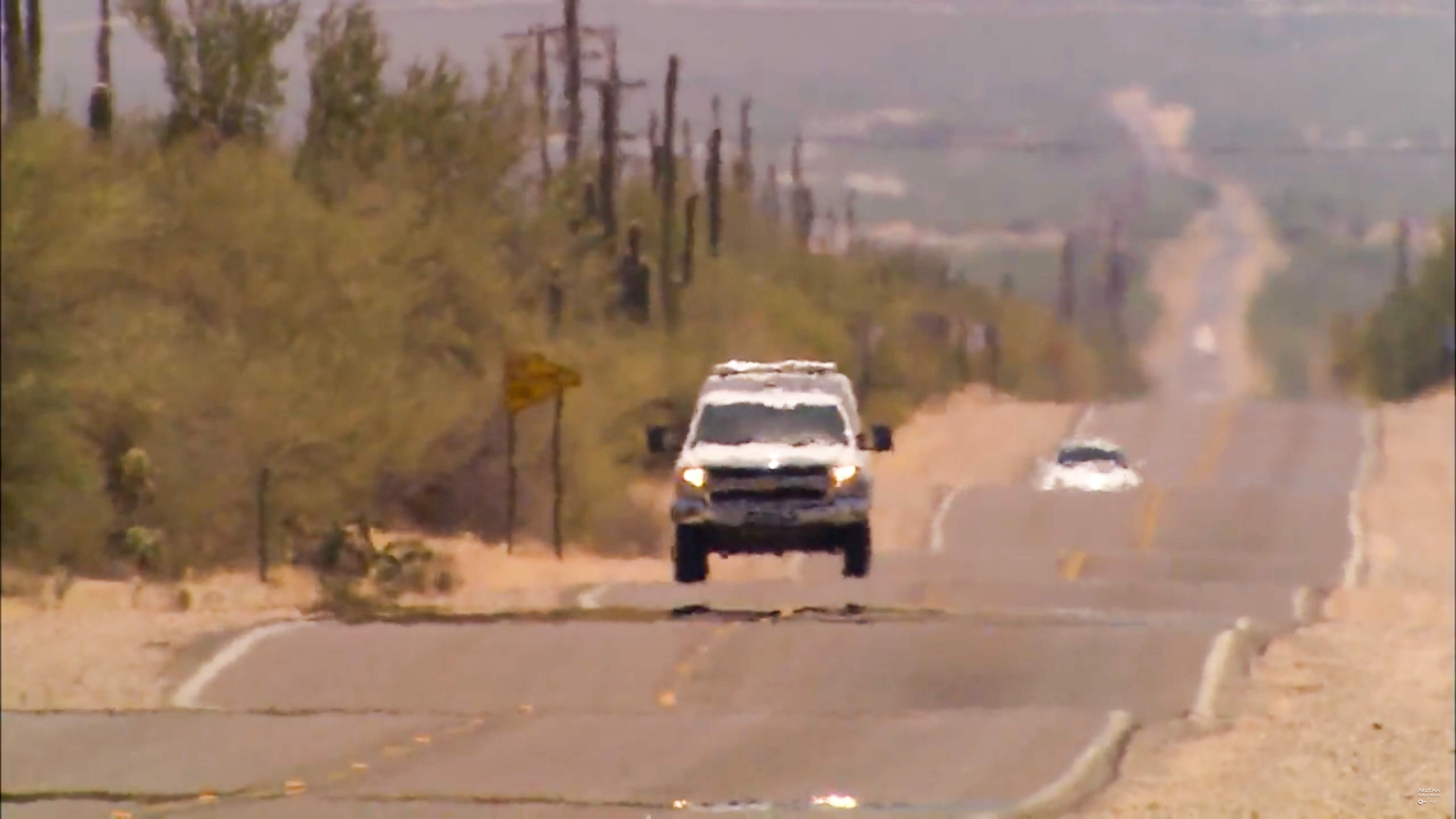 Vehicles driving in the summer heat.