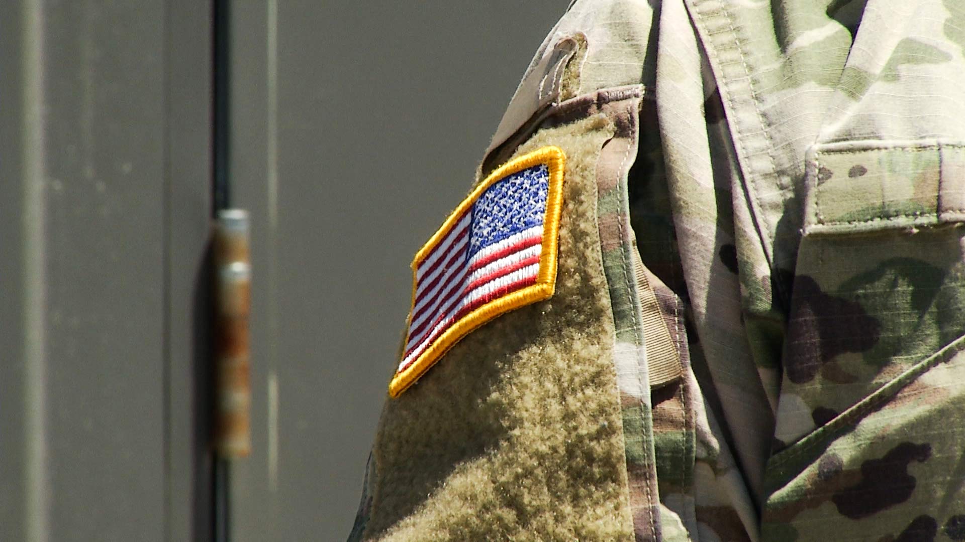 A U.S. flag on the uniform of a member of the National Guard.