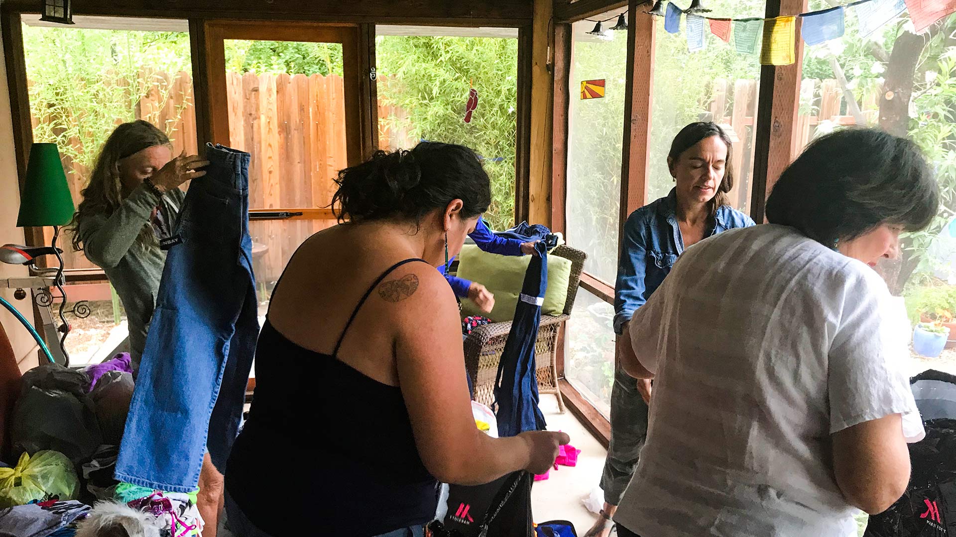 Voices From the Border members organizing donated items for Central American families waiting on the Mexican side of the Nogales border. 