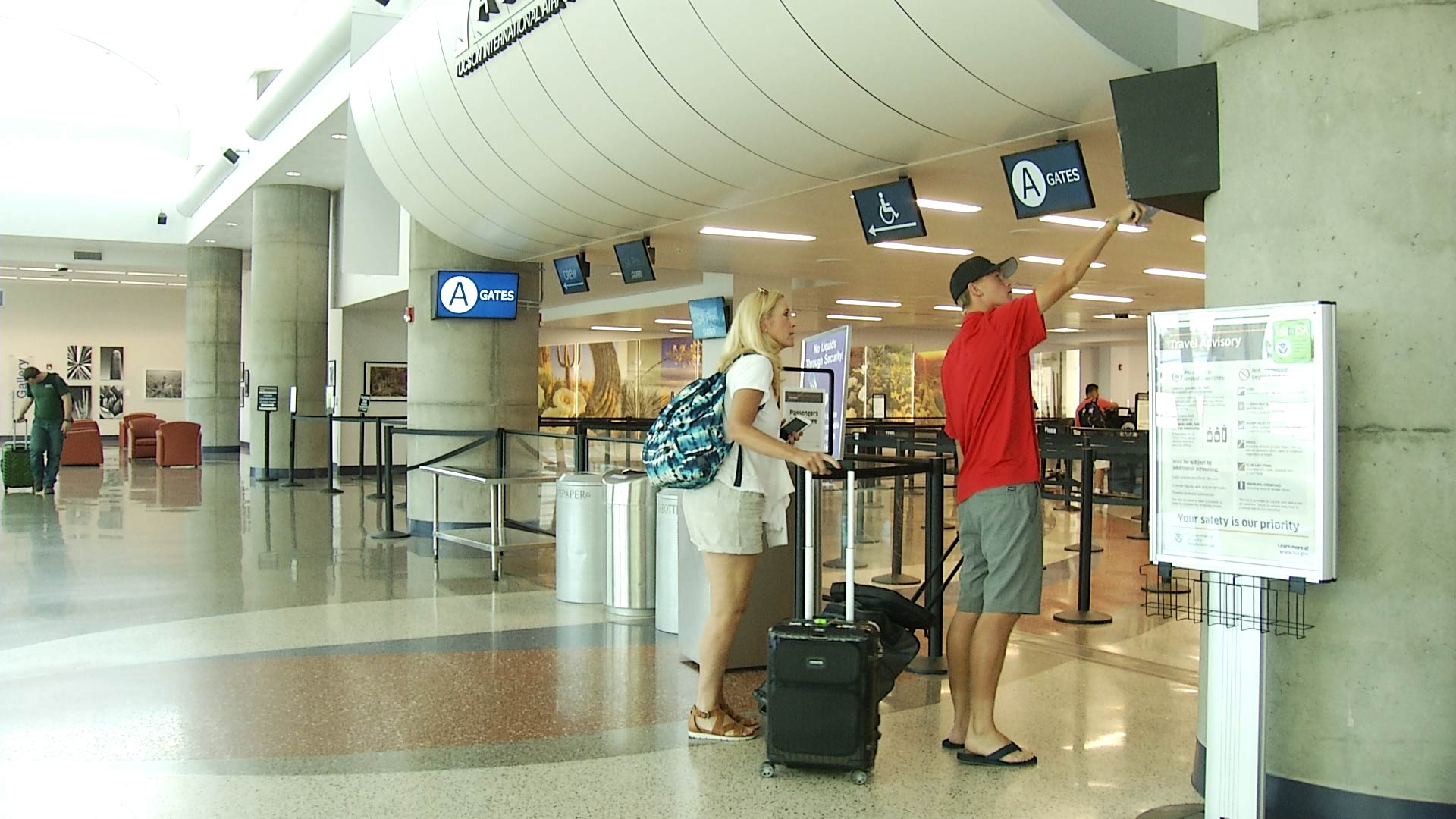 Passengers approach the remodeled security checkpoint at Tucson International Airport. 