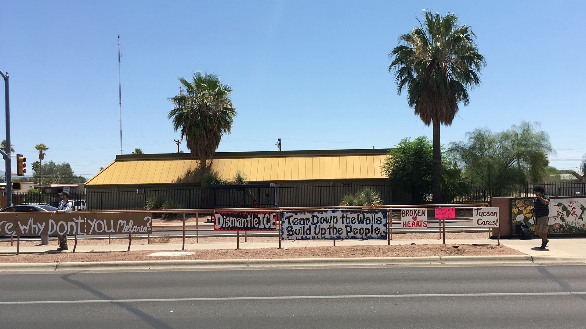Protestors outside a Southwest Key facility near Oracle Road and Drachman Street in Tucson hung signs in preparation for a visit by First Lady Melania Trump. Mrs. Trump did not tour any of the facilities that house migrant children in the Tucson area.