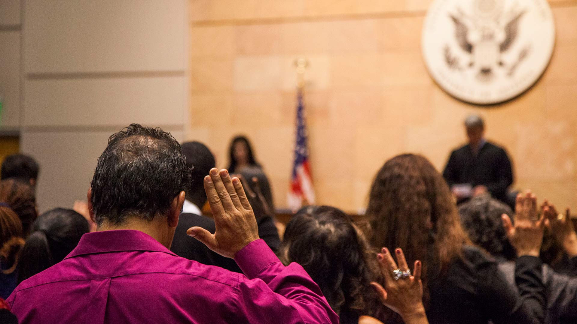 Soon-to-be U.S. citizens taking an oath at a naturalization ceremony at the Evo A. DeConcini U.S. Courthouse in Tucson, February 2018.