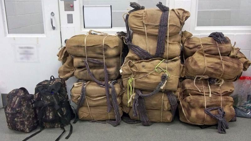 A policy change at the U.S. attorney's office in Arizona increases penalties on marijuana smugglers who cross the border on foot with backpacks, like these seized in 2017.