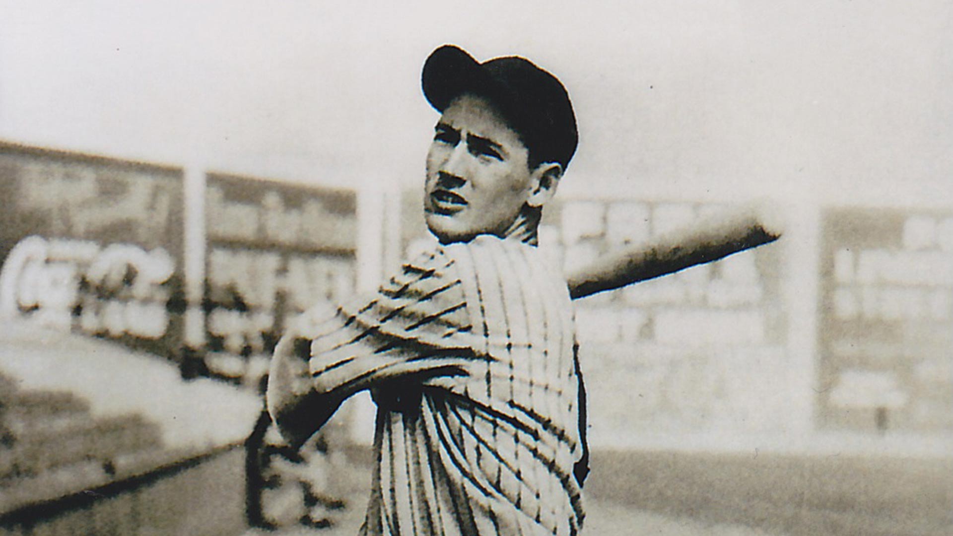 Ted Williams at Lane Field, bat over shoulder.