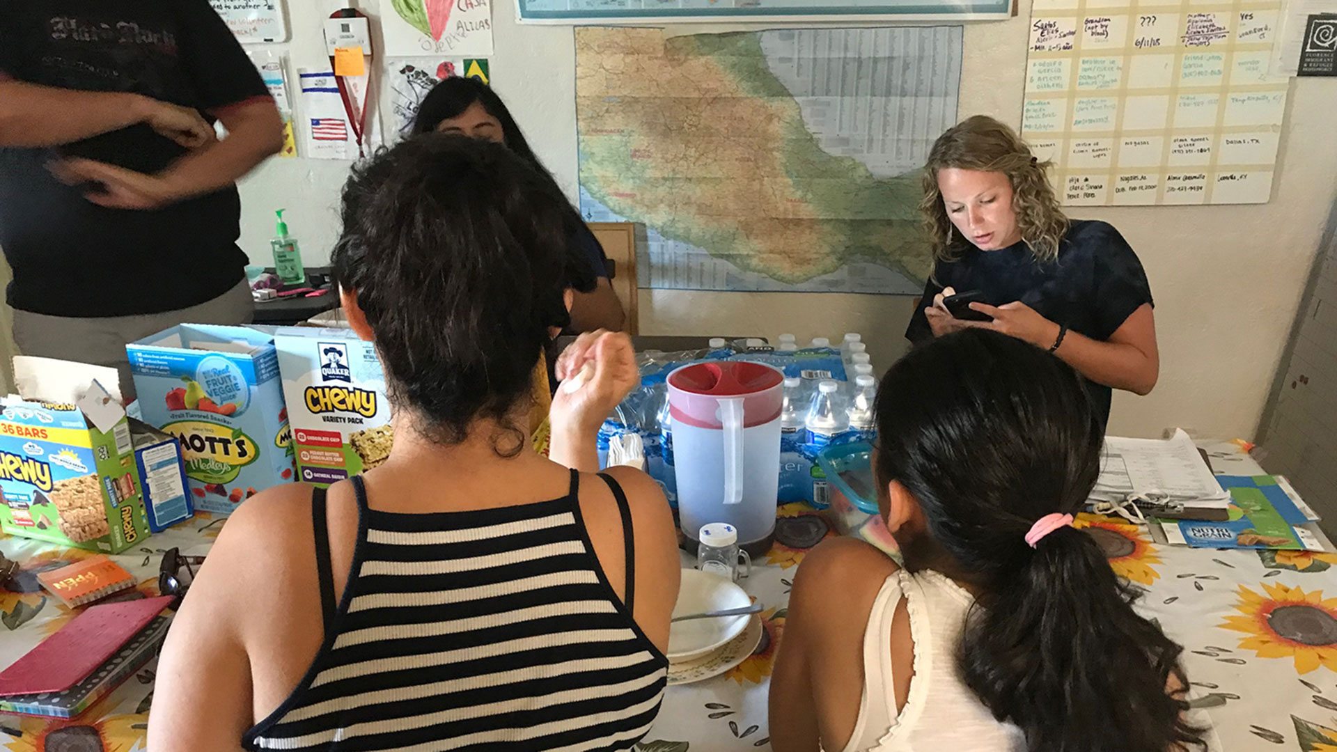 Medina and Daniella, foreground, at Tucson's Casa Alitas, July 17, 2018. They asked Arizona Public Media not to show their faces.