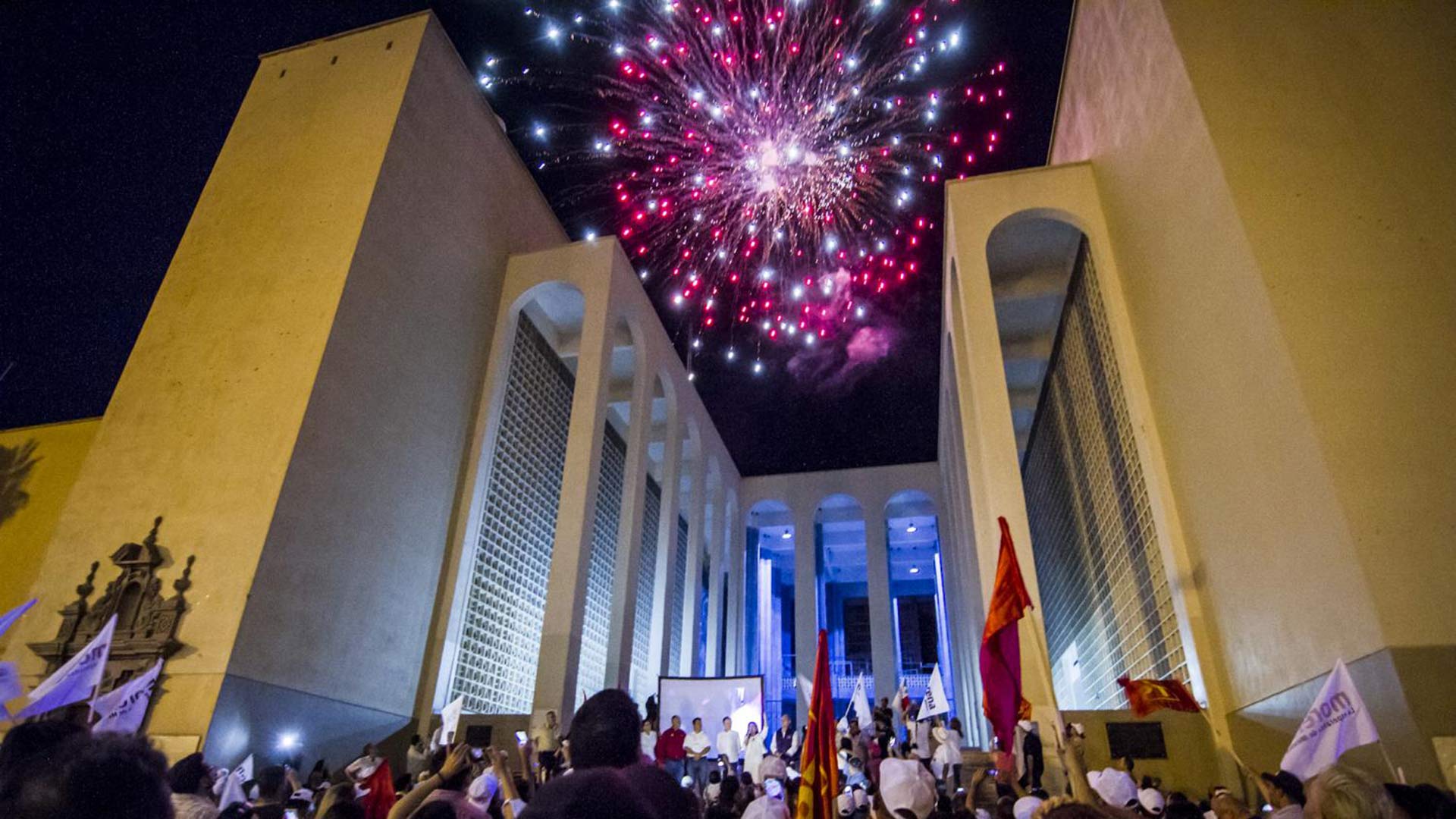 People watch fireworks on Sunday, July 1, 2018, at a rally for Mexico's presidential election in Hermosillo, Sonora.