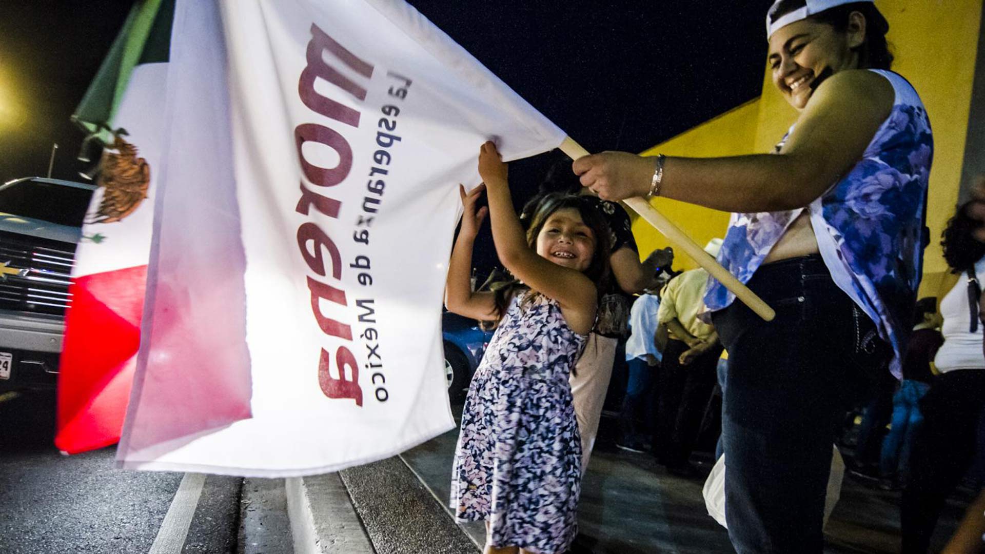 Waving a flag of the Morena party of Andrés Manuel López Obrador in Hermosillo, Sonora, July 1, 2018.