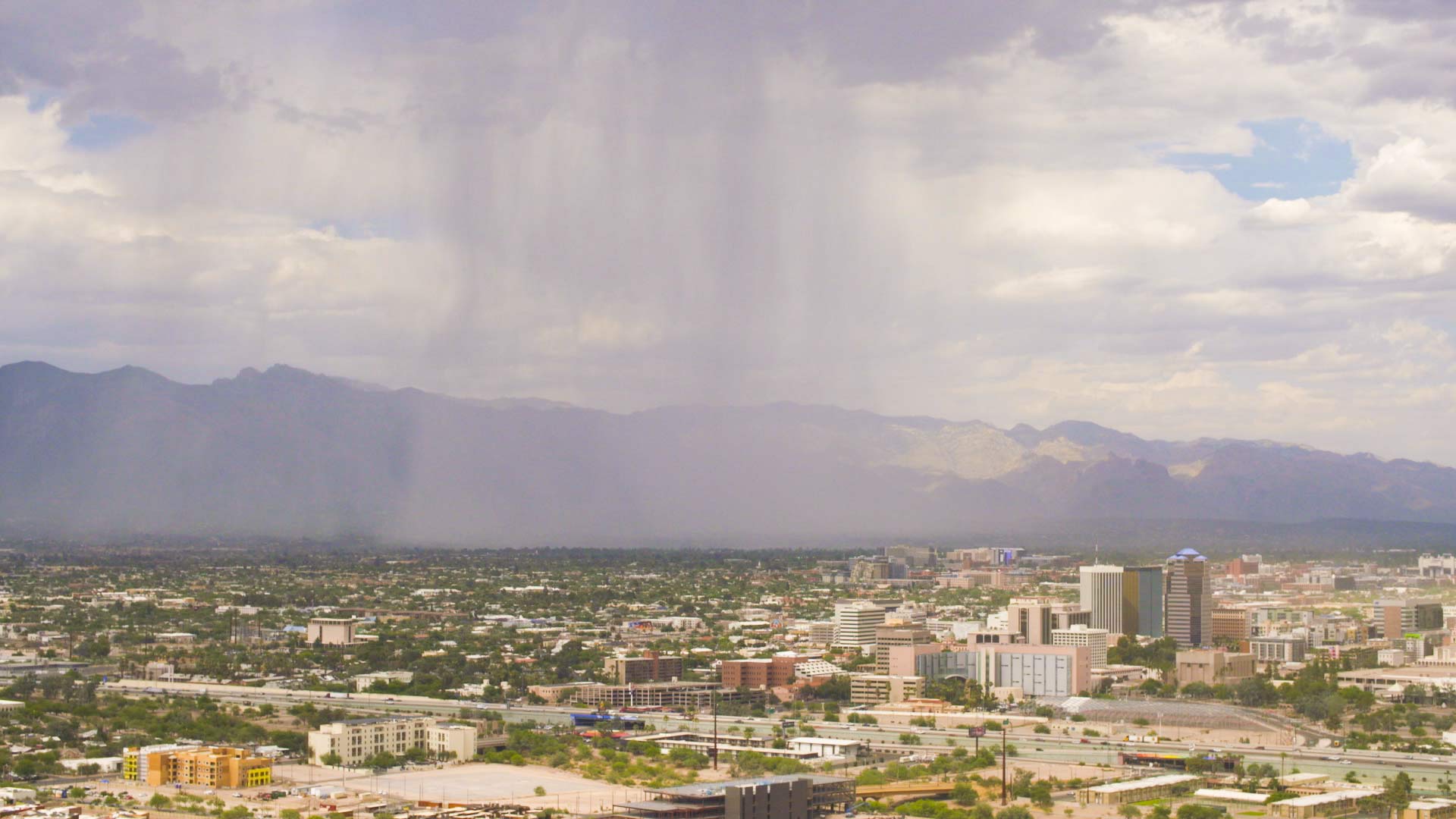 Rain and sunlight interact over Tucson, July 5, 2018.