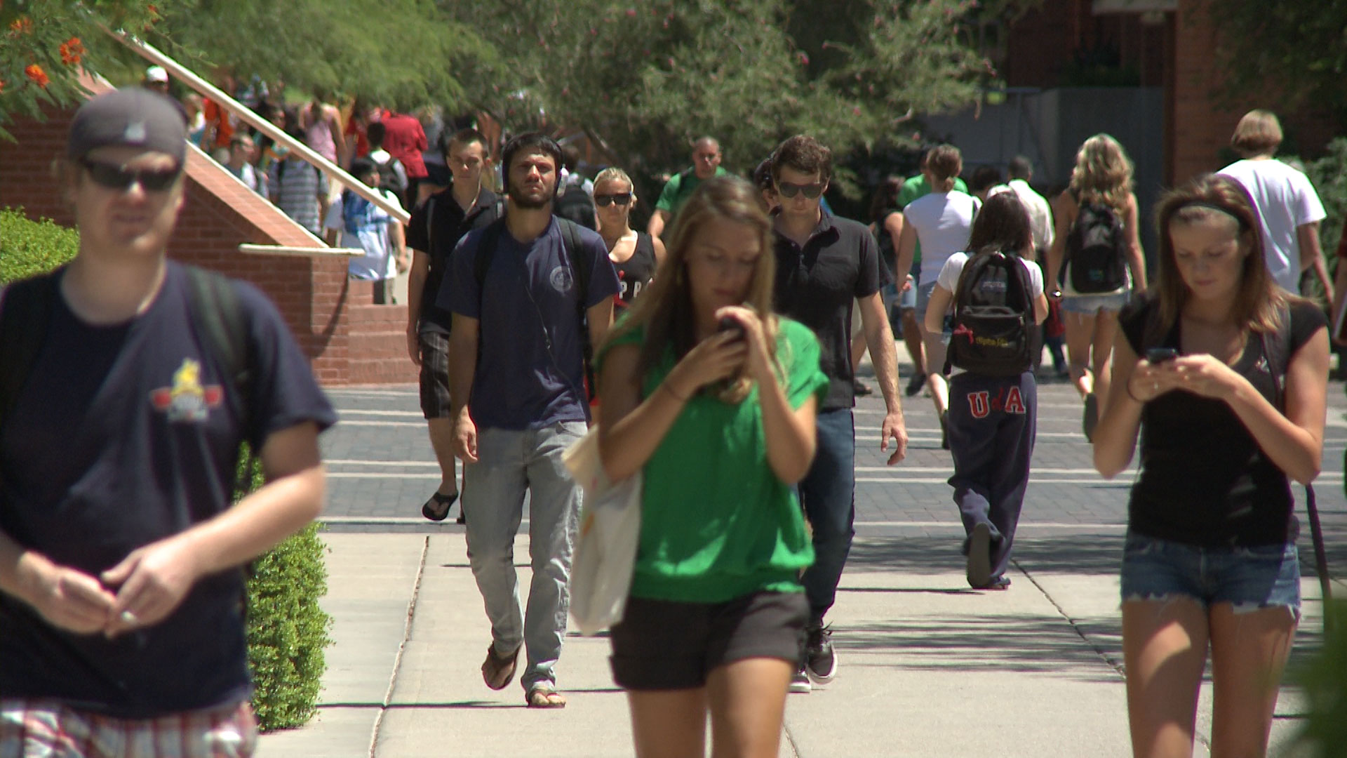 Students walk on campus at the University of Arizona. 