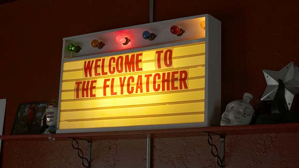 A sign inside Flycatcher welcoming patrons.