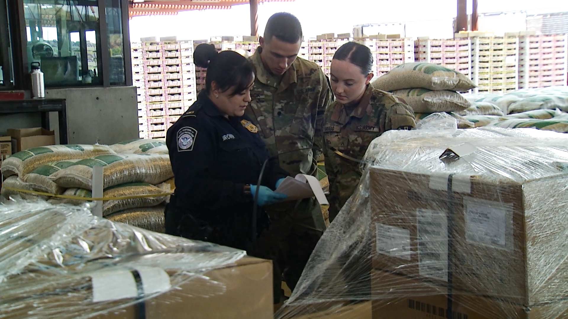 National Guard troops receive inspection training from a Customs and Border Patrol official at the Mariposa Port of Entry in Nogales, Arizona on August 1, 2018. 