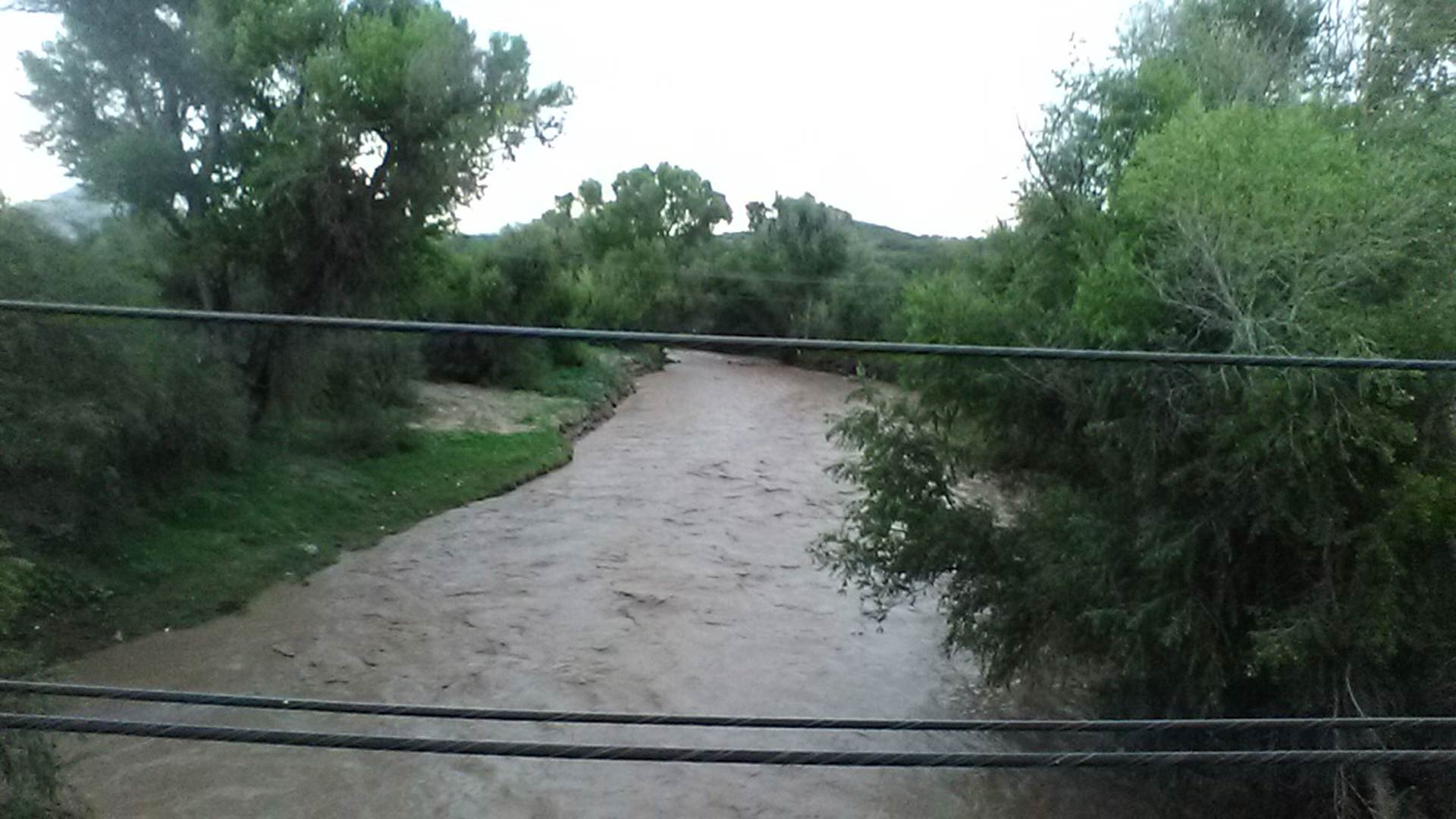 Nogales Wash in downtown Nogales, Arizona running bank to bank. (August 13, 2018)