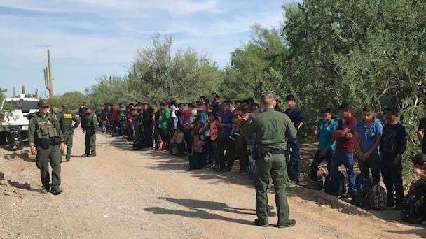 A Customs and Border Protection image accompanying a press release about a group of 128 migrants detained at the U.S.-Mexico border.