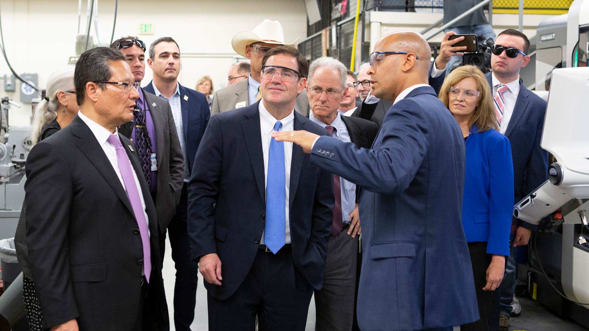 Gov. Doug Ducey tours Pima Community College's downtown campus as part of a Caterpillar announcement, Aug. 24, 2018.  From left, Lee Lambert, PCC Chancellor; Ducey; Greg Wilson, PCC academic dean of business, occupational and professional programs; and Jean Savage, vice president for Caterpillar’s surface mining and technology division. 