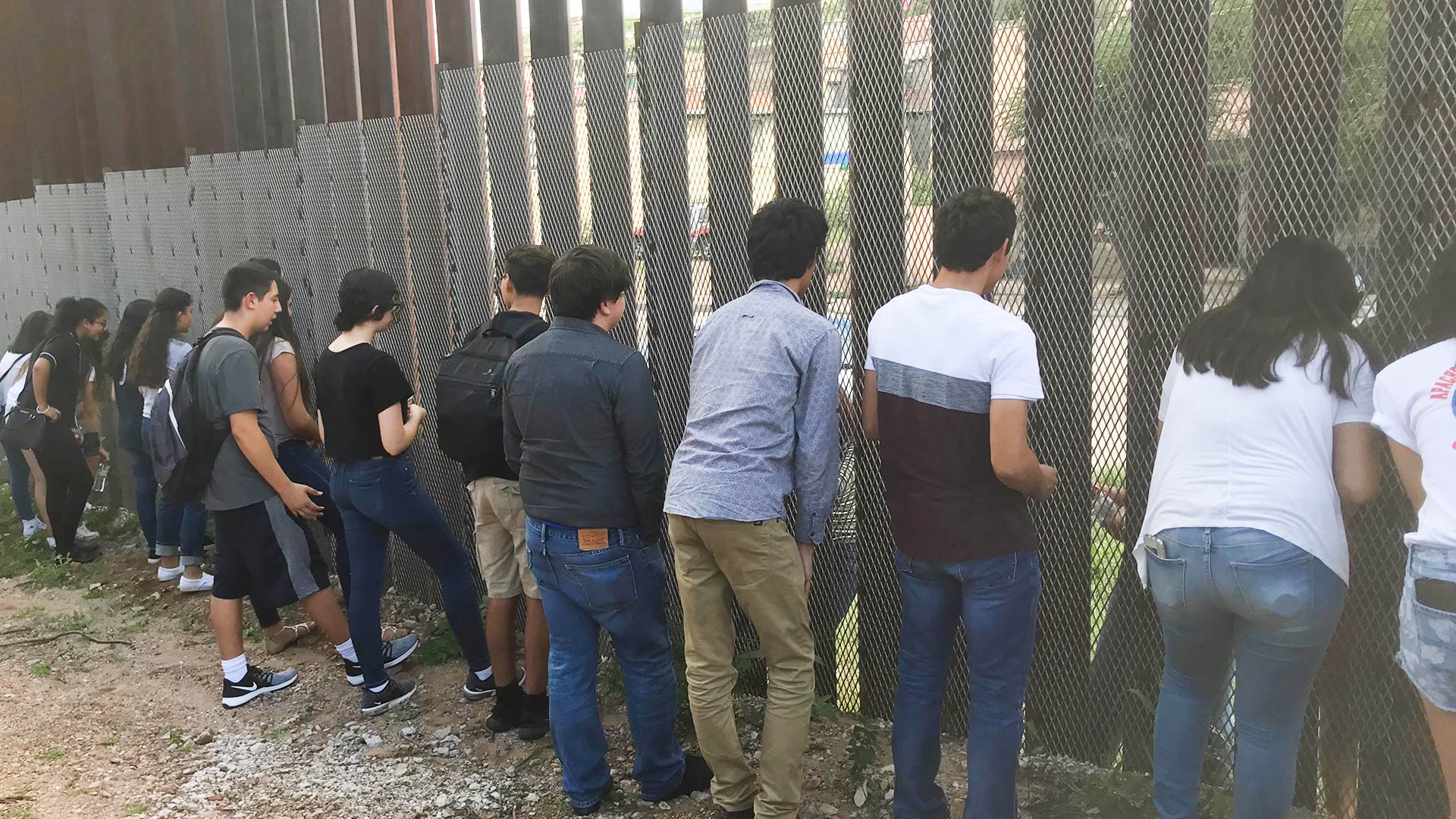 Teens on the Nogales, Arizona, side of the border fence get to know young people on the Mexican side for a project called "Beyond the Wall," Aug. 25, 2018.