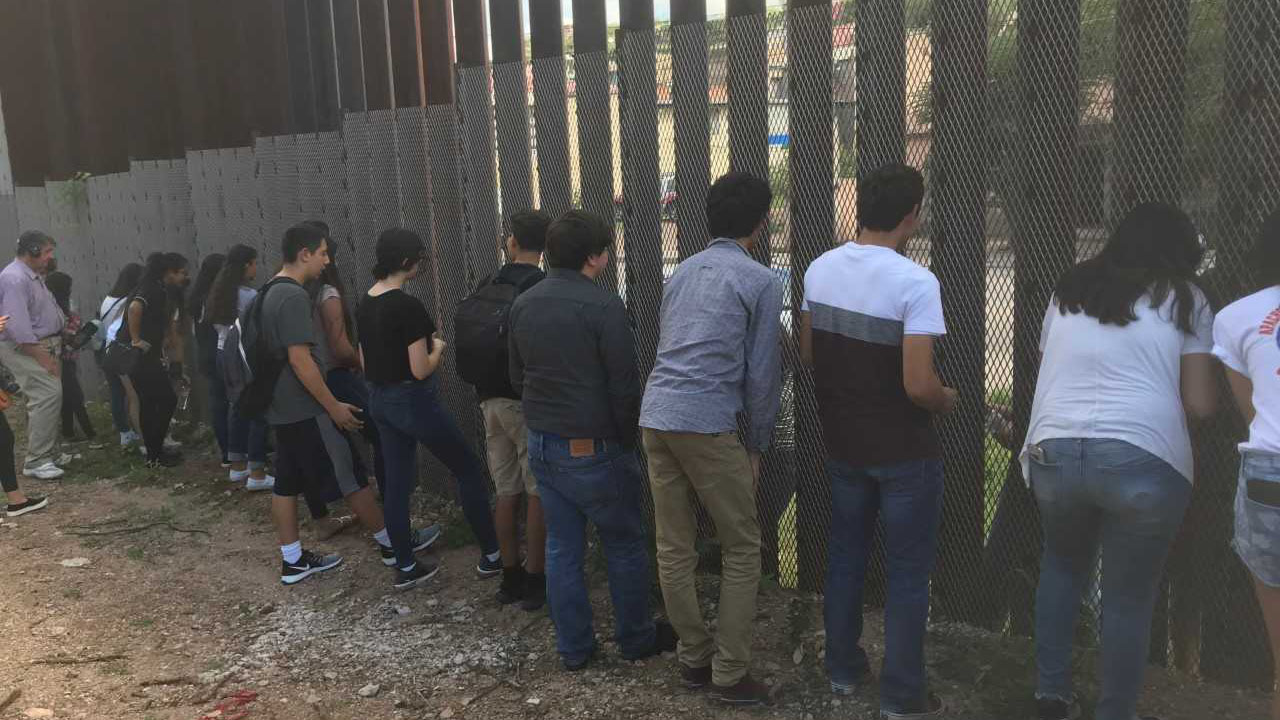 20 students from Nogales, Arizona and 20 from Nogales, Mexico take part in a unique program about listening at the border wall that runs through their city.