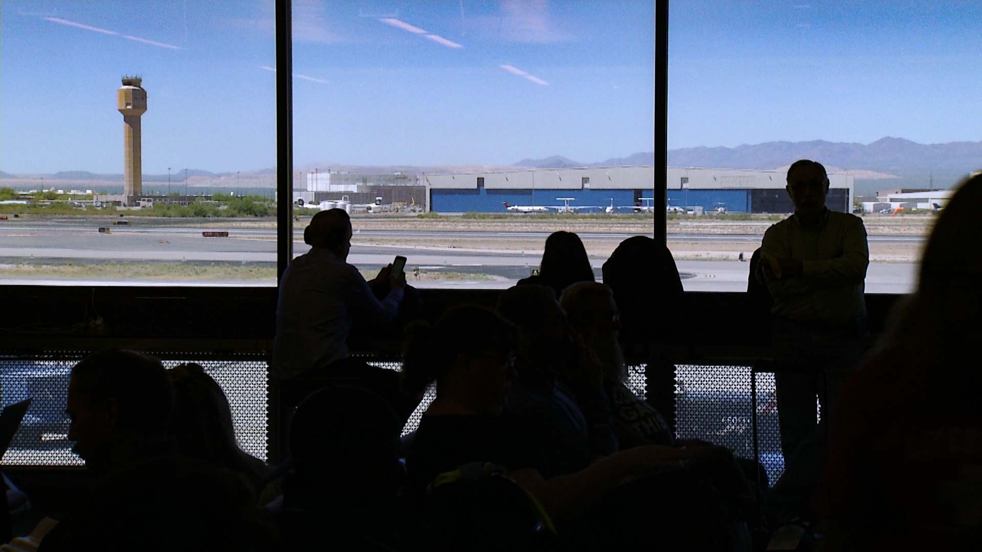 Looking out at the tower at the Tucson International Airport.