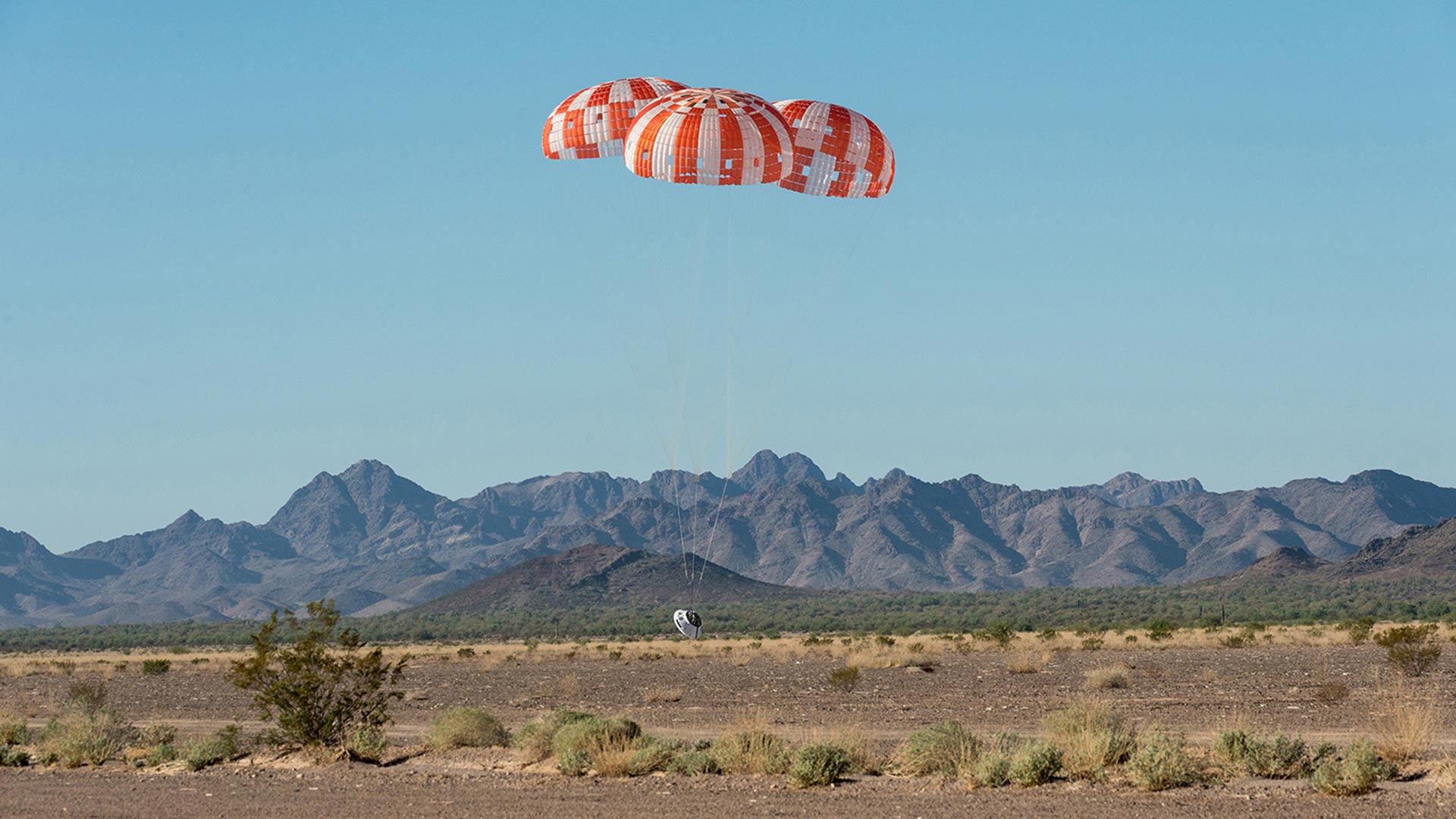 Touching down during a Sept. 12 parachute test for the Orion spacecraft at the Yuma Proving Grounds.