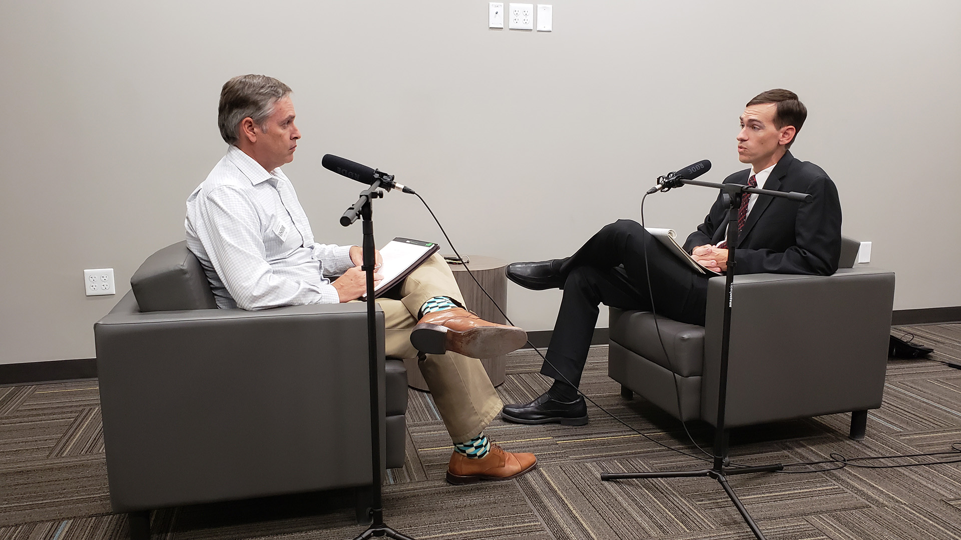 AZPM's Christopher Conover, left, interviews Matthew Du Mee, unit chief counsel for the Consumer Protection and Advocacy Section of the Arizona attorney general's office.