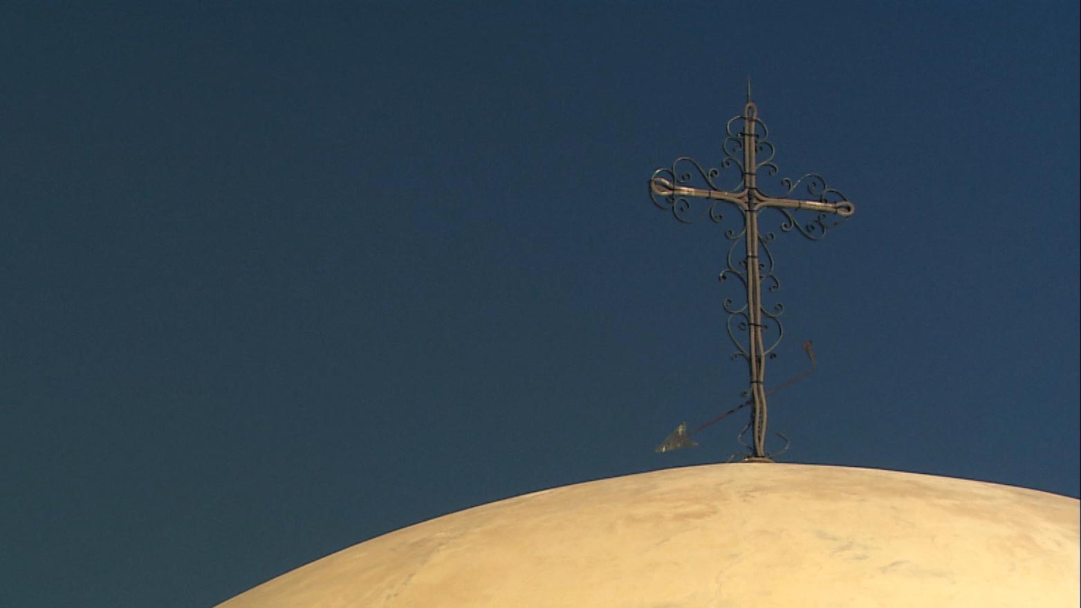 A cross atop the San Xavier Mission. 