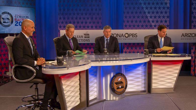 A scene from Monday night's debate among candidates for governor. From left, Democrat David Garcia, moderator Ted Simons, Green Party candidate Angel Torres and Republican Doug Ducey.