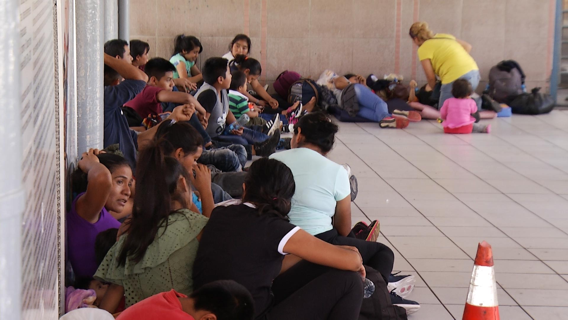 Families seeking asylum await processing outside the port of entry in Nogales, Sonora, on Sept. 4, 2018. 