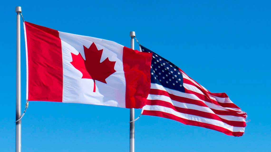 The flags of Canada and the U.S.