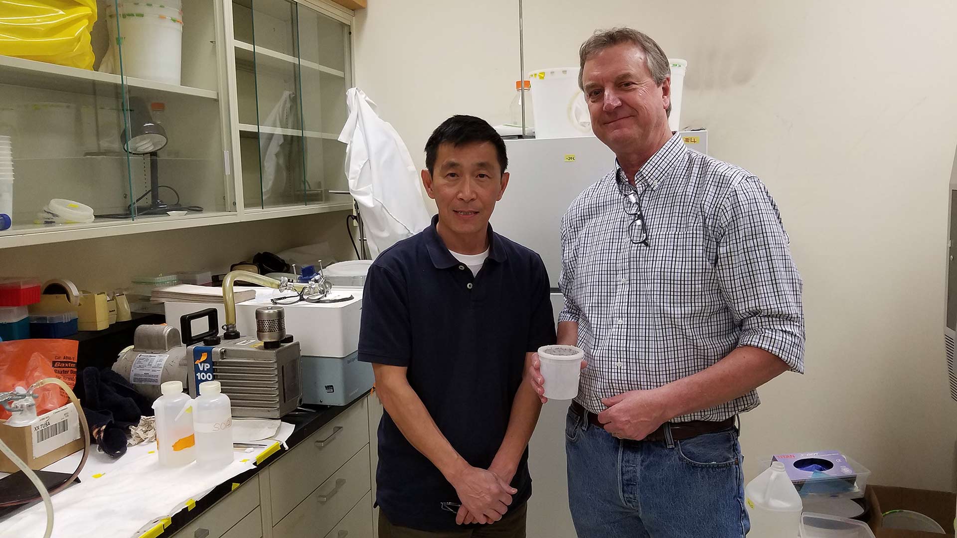 Researcher and professor Jun Isoe, left, and Roger Miesfeld, head of the department of chemistry and biochemistry at the University of Arizona