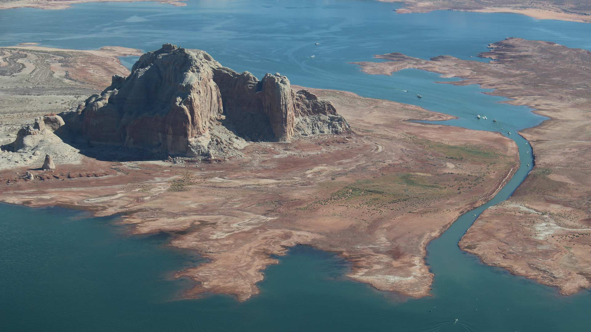 Lake Powell on the Utah-Arizona border continues to drop as snowpack declines throughout the southwestern U.S. The narrow passageway shown here in September 2018 has been rendered unusable as water levels drop. 
