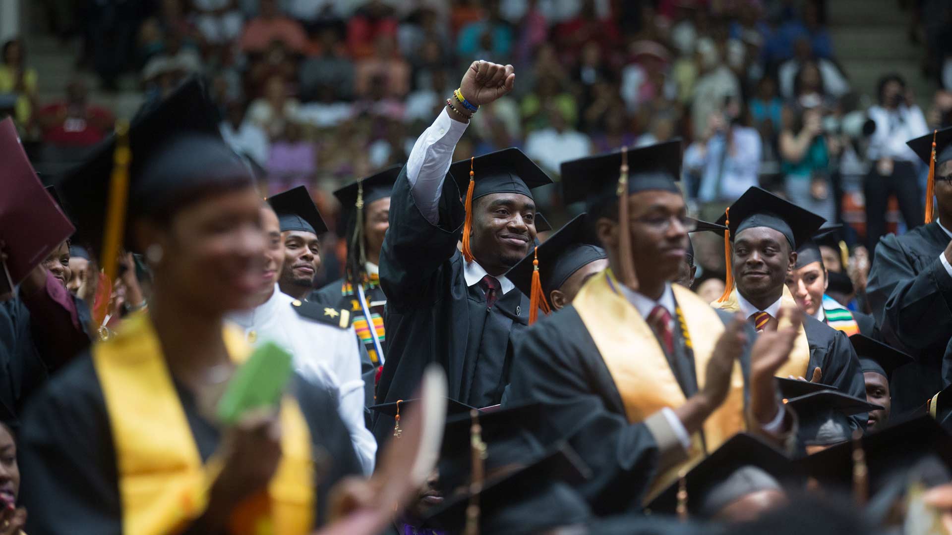 Students listen to then-First Lady Michelle Obama's remarks for the Tuskegee University commencement ceremony in Tuskegee, Alabama, May 9, 2015.