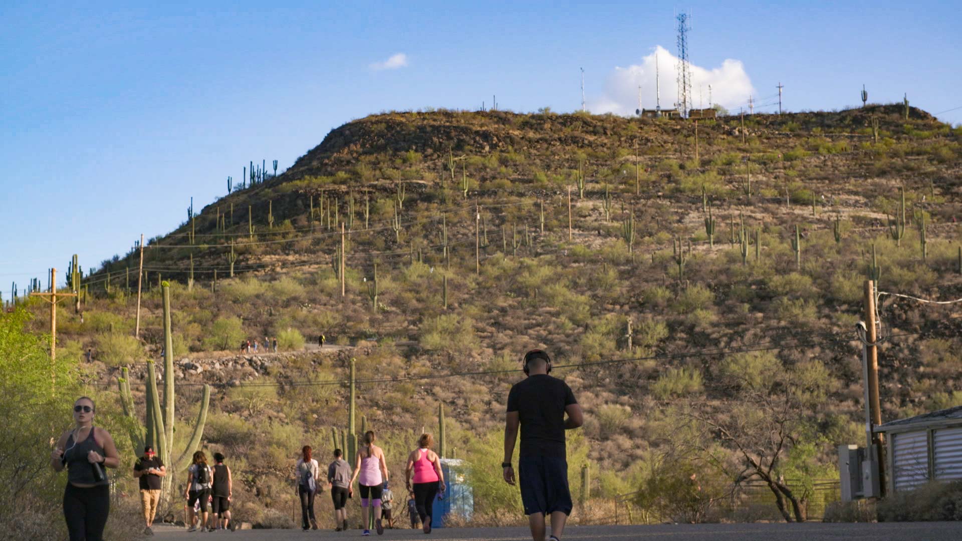 Pedestrians at the midway point on their way up Tumamoc Hill.