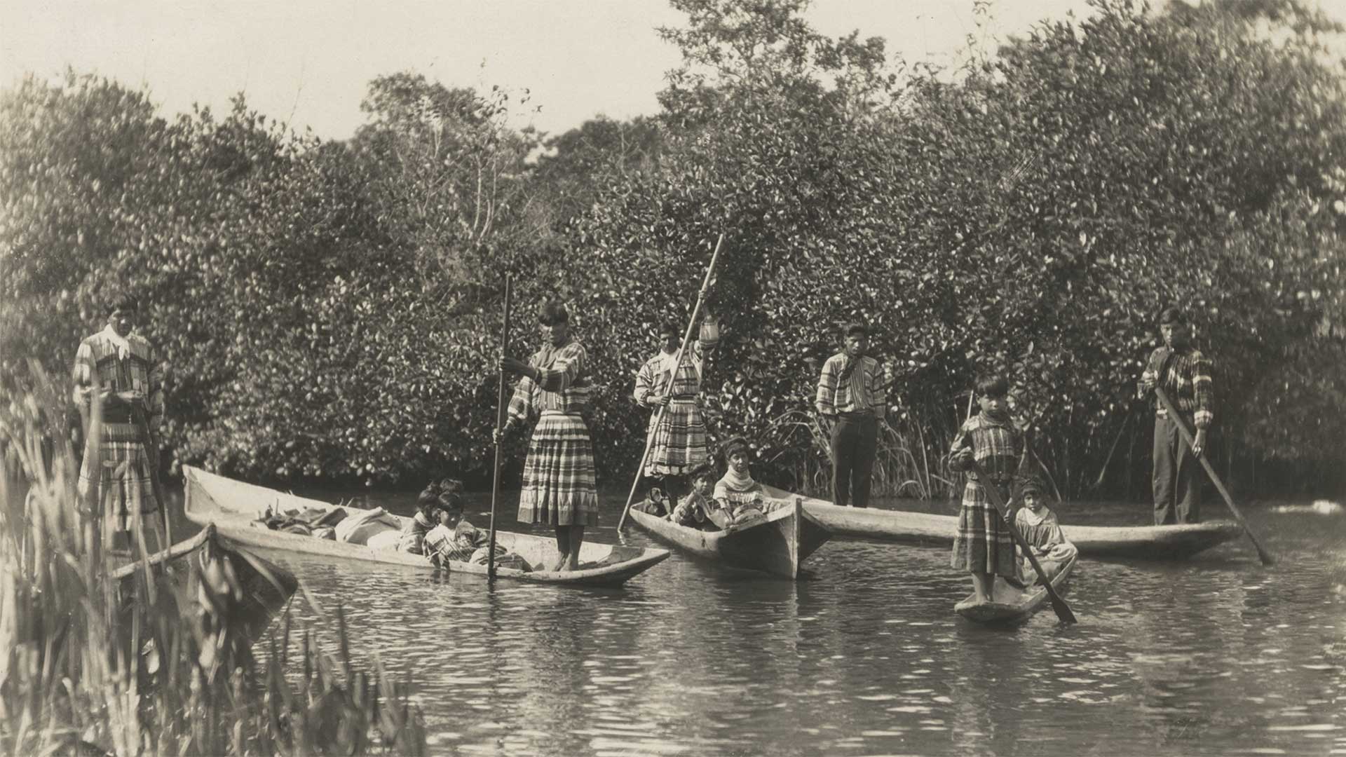 A group of Seminole Indians in dugout canoes in the Everglades, January 18, 1921.