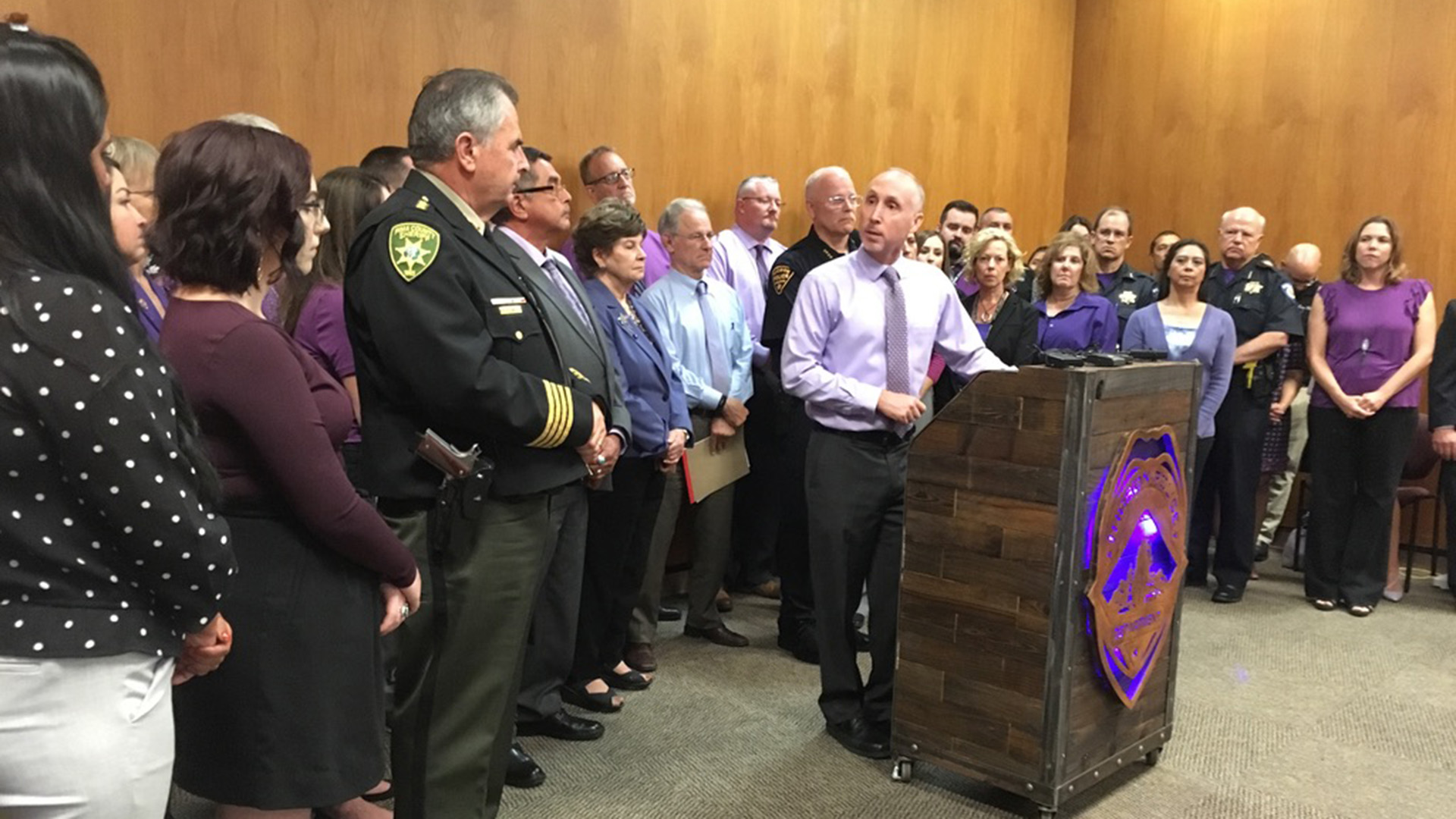 Ed Mercurio-Sakwa, the CEO of Emerge! Center Against Domestic Abuse, speaks to a group of city and county officials and staffers at a press conference for Domestic Violence Awareness Month October 1, 2019.