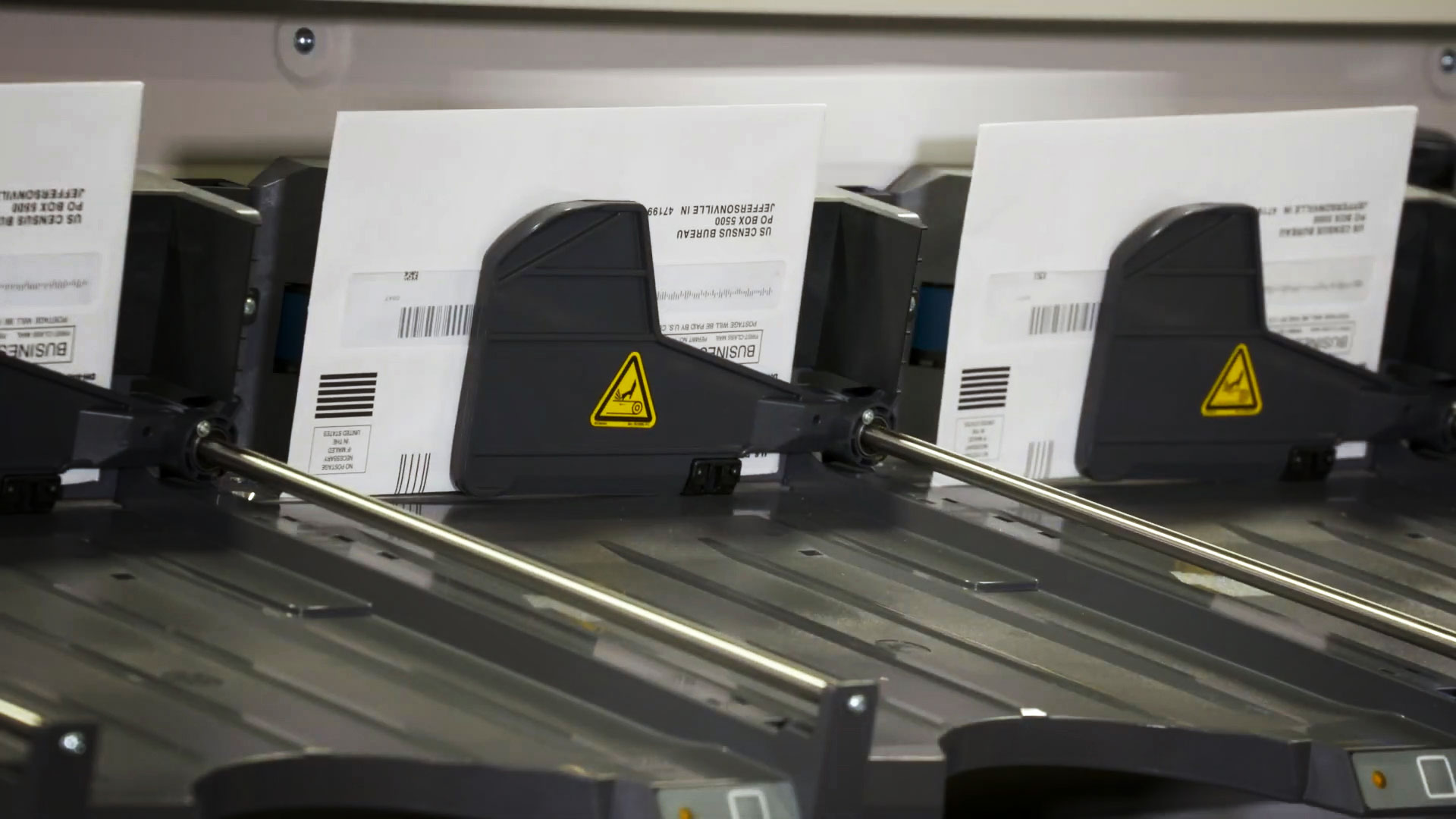 A machine processes mail from the U.S. Census Bureau at its Print Data Capture Center in Phoenix. 