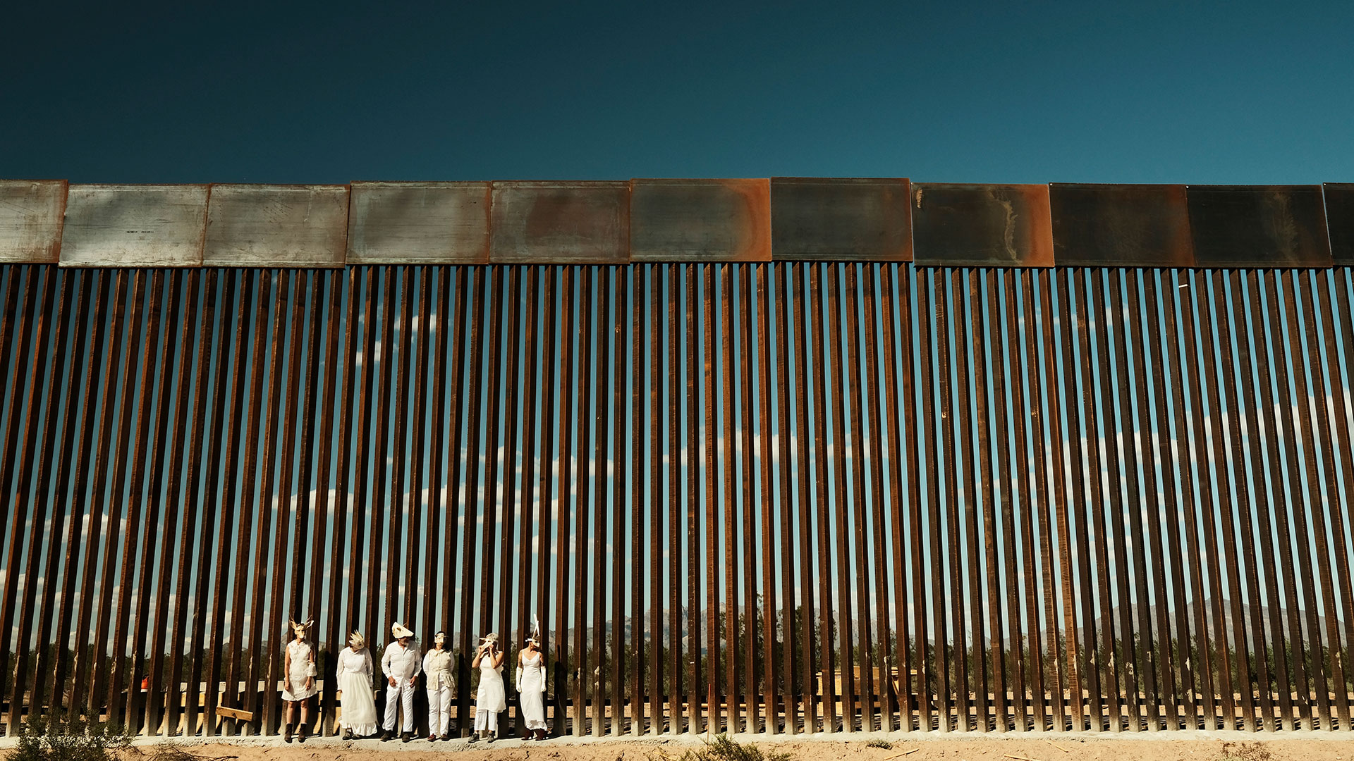 Artists at border wall 