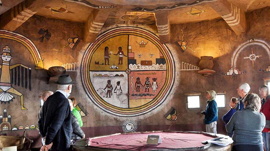 Visitors observe murals inside of the Desert View Watchtower at the Grand Canyon, in this National Parks Service media release photo.