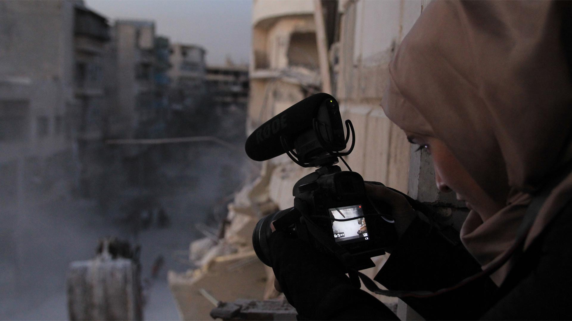 Waad al-Kateab filming the ruins of a building destroyed by bombing in besieged east Aleppo in October 2016.