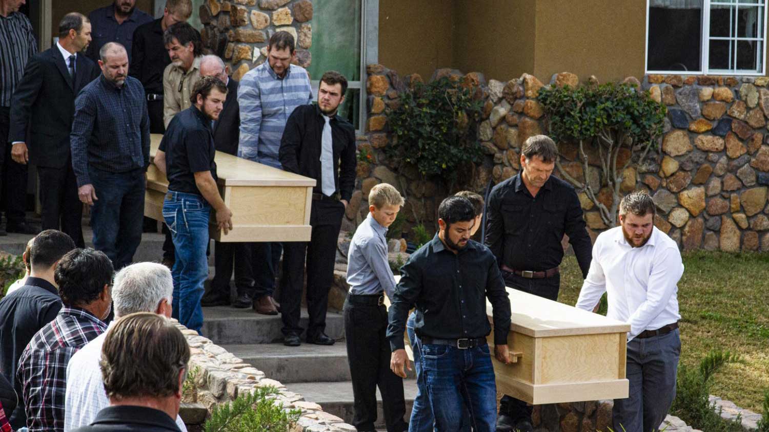 Family members carry caskets toward the ceremony on Nov. 8, 2019, for three of those killed in the vicious attack against a small Mormon community in Sonora on Nov. 4, 2019.