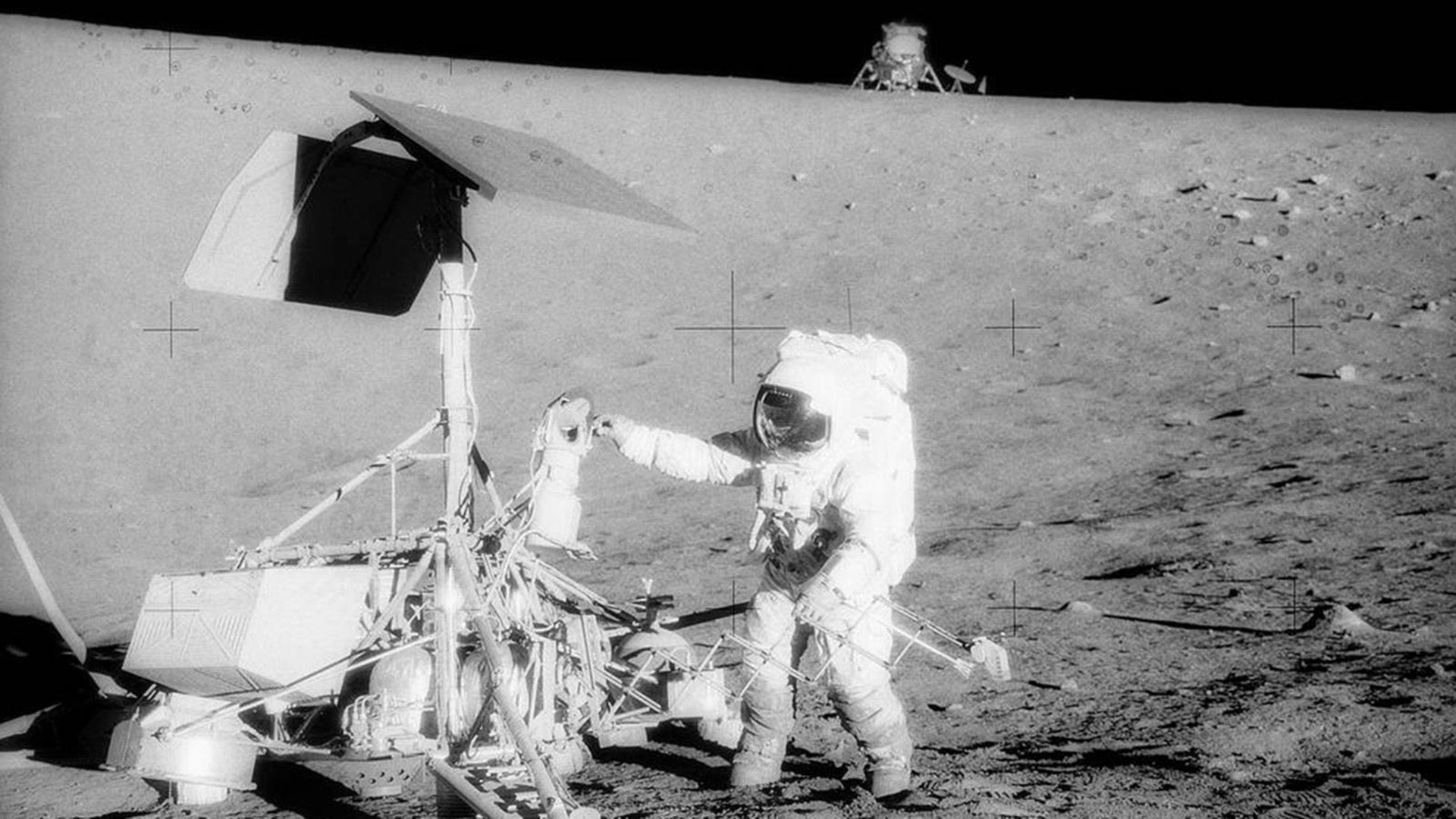 Apollo 12 astronaut Alan Bean inspects Surveyor 3