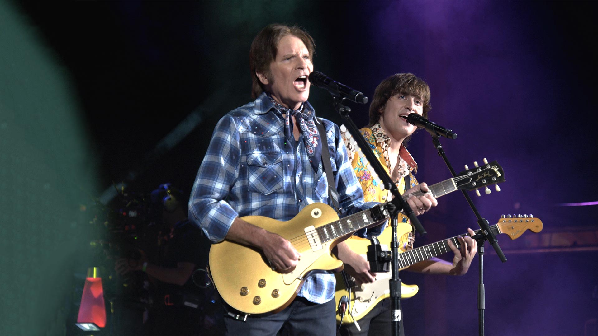 John Fogerty performing with his son Shane in JOHN FOGERTY: MY 50 YEAR TRIP, inspired by the 50th anniversary of Woodstock and John's hit parade with Creedence Clearwater Revival